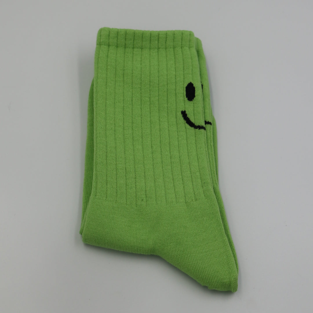 RollerFit ribbed crew socks with a smiley face eyes and mouth design above the heel: bright green with black smiley face