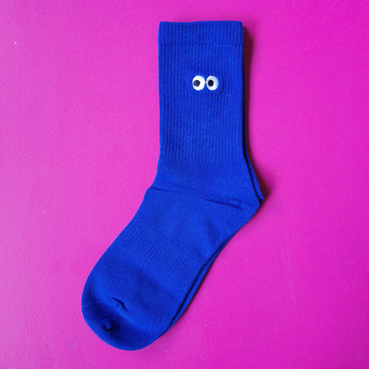 Cobalt blue coloured crew sock with embroidered cartoon eyeball design