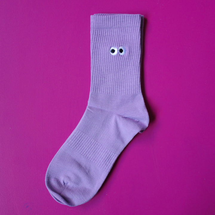 Lilac purple coloured crew sock with embroidered cartoon eyeball design