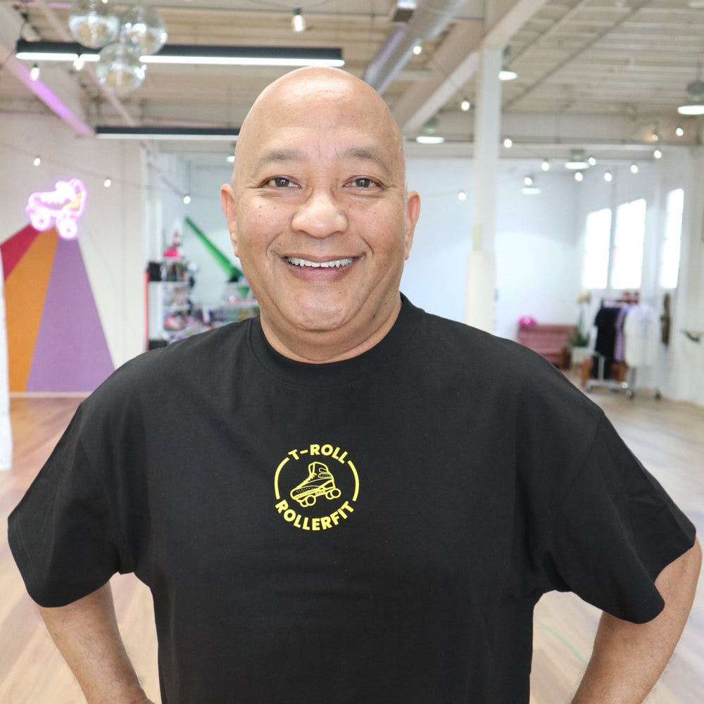 T-Roll wearing the RollerFit x T-Roll anniversary black and yellow oversized t-shirt at RollerMart in Sydney