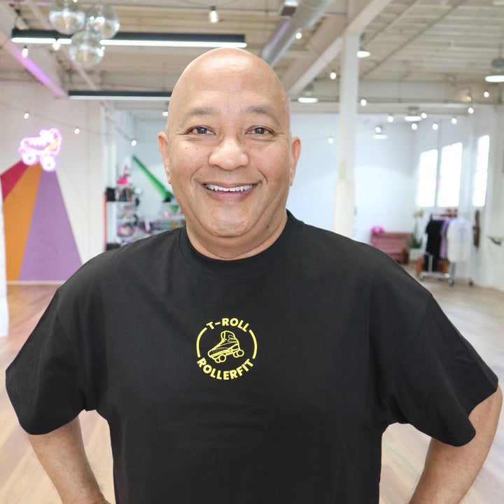 T-Roll wearing the RollerFit x T-Roll anniversary black and yellow oversized t-shirt at RollerMart in Sydney