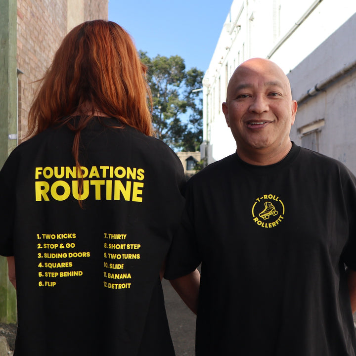 Stacey and Tony wearing the RollerFit x T-Roll anniversary black and yellow oversized t-shirt