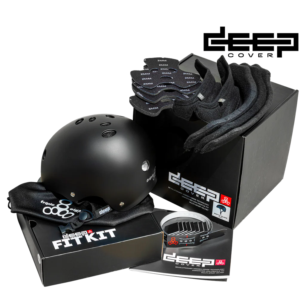 Triple 8 black helmet with deep cover fit kit pieces sitting on a box.