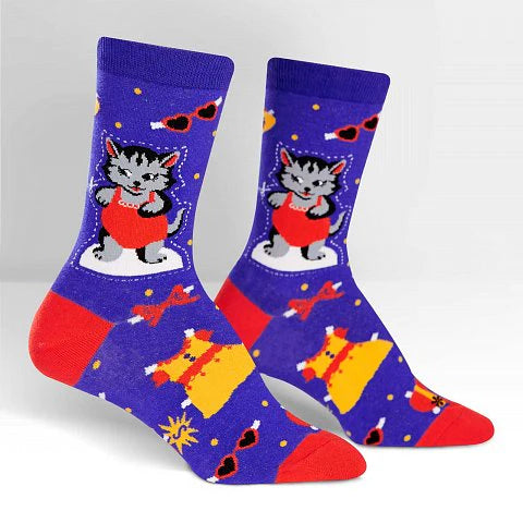 Navy blue socks with grey cats playing dress up with yellow dress, red bows and sunglasses.
