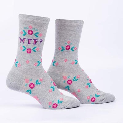 Grey marle socks with pink, purple and teal floral cross stich motifs and "WTF?" text.