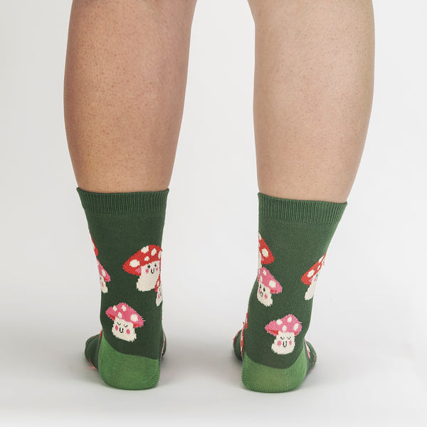 Forest green socks with fuzzy pink and red mushrooms with cute smiley faces.