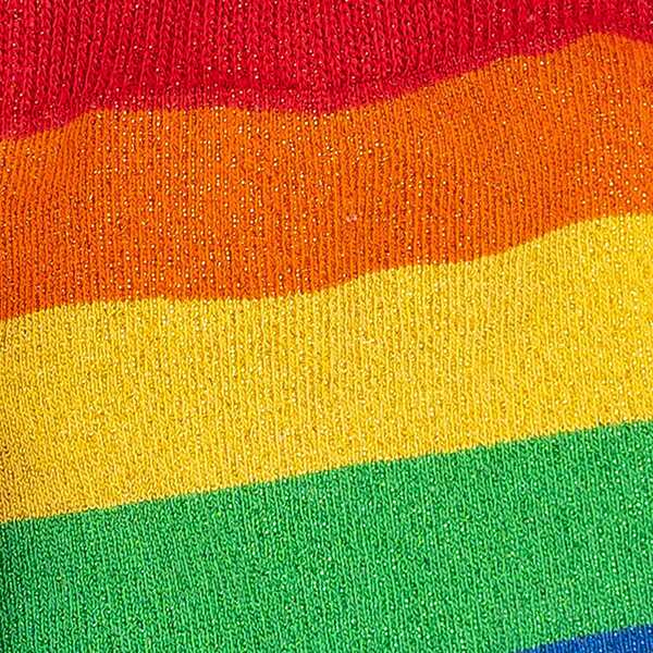 Close up view of glittery rainbow stripe sock material.