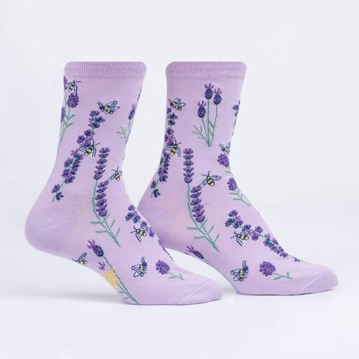 Lilac socks with lavender flower stems and yellow bees.