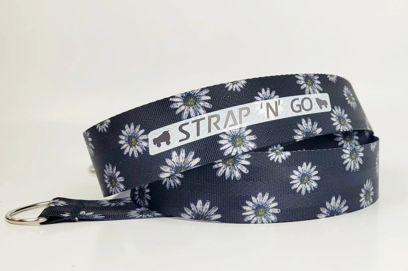 Strap N Go skate leash with black background and white daisies
