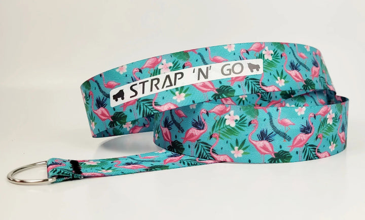 Strap N Go skate leash in Flamingo: teal background with green leaves, white flowers and pink Flamingos