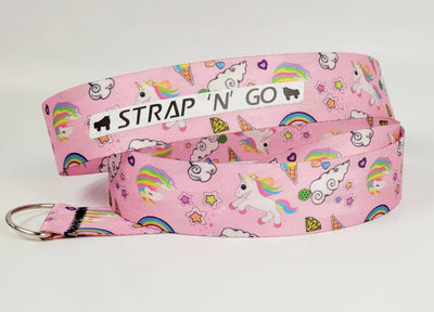 Strap N Go skate leash in Unicorn Galaxy print: a pastel pink background with cartoon stars, gems, clouds and rainbow unicorns
