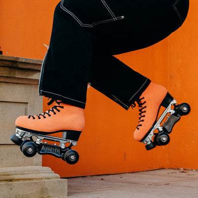 Sophie jumping a set of stairs in Chuffed Skates Wild Thing Pro Boots.