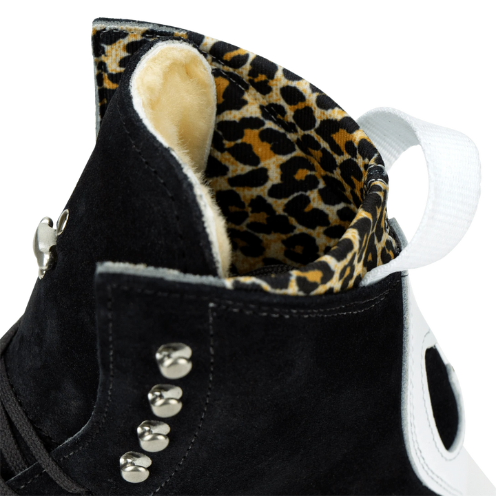 Moxi Roller Skates Jack 1 Boots in black with white backstay and leopard print lining.