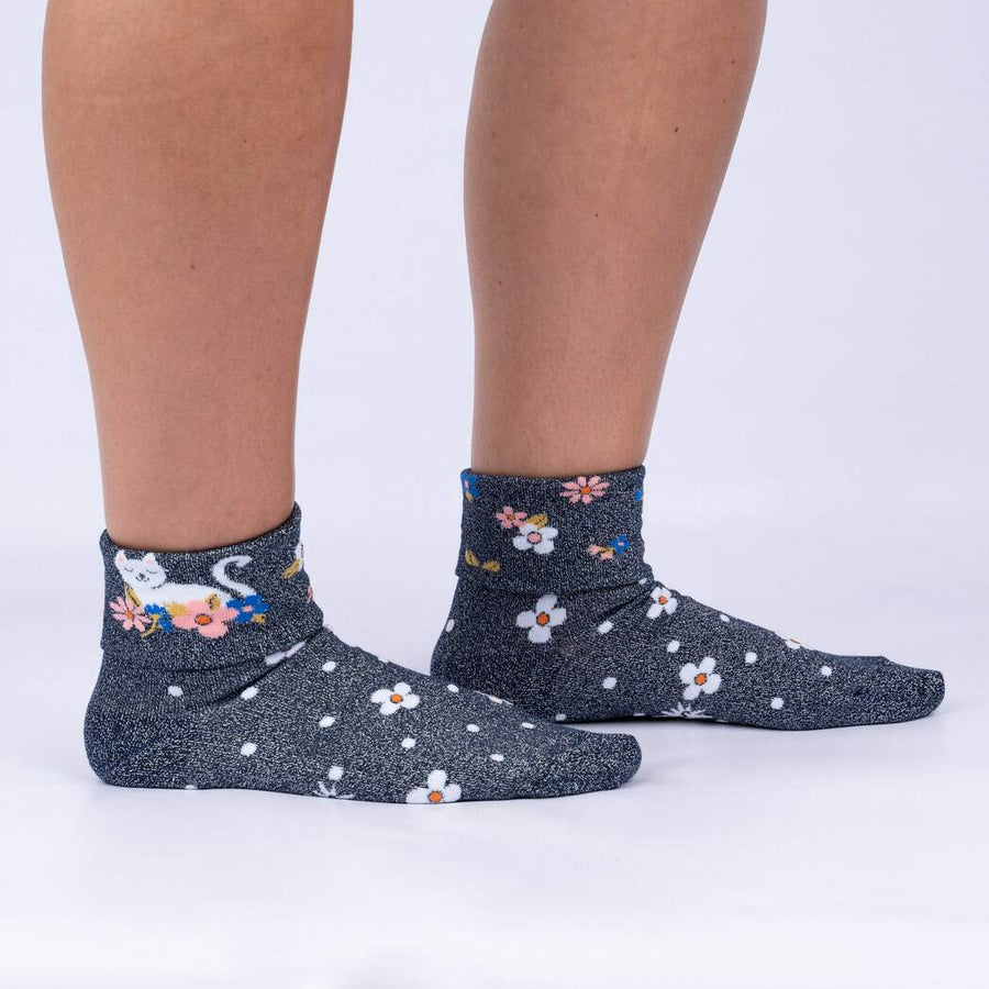 Black glitter turn cuff crew socks with white, blue and pink flower and white cats.