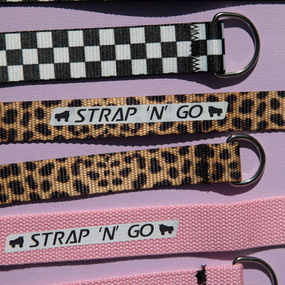 3 Strap N Go roller skate leashes on a purple background.
