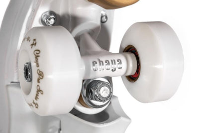 Chaya Kismet Barbiepatin white and gold roller skate with white trucks and hardware.