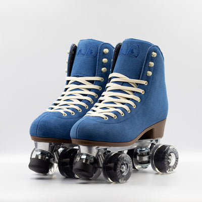 Chuffed Skates Wanderer roller skates in classic blue with cream laces and eyelets, black toe stop, and clear wheels. 