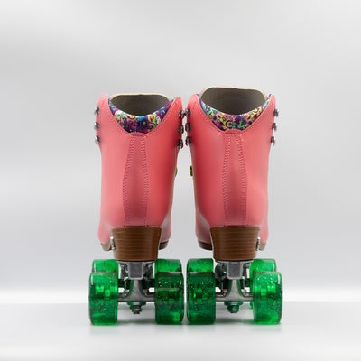 Moxi Roller Skates Beach Bunny skates in Watermelon pink with bright green laces and wheels.