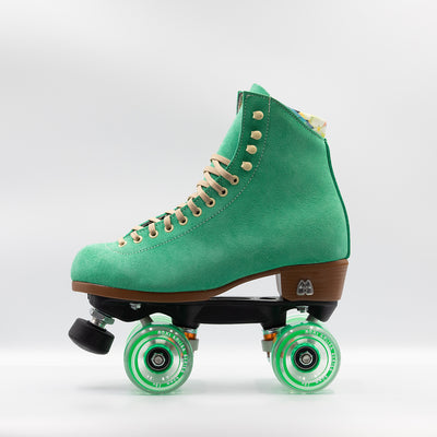 Moxi Roller Skates Lolly roller skate in Green Apple with oyster laces, black plate and toe stops, and matching green wheels.