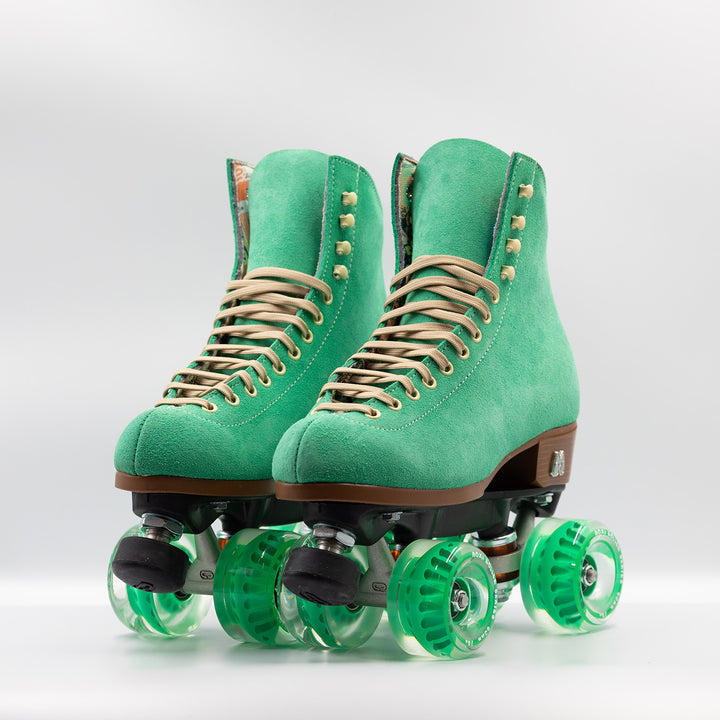 Moxi Roller Skates Lolly roller skate in Green Apple with oyster laces, black plate and toe stops, and matching green wheels.