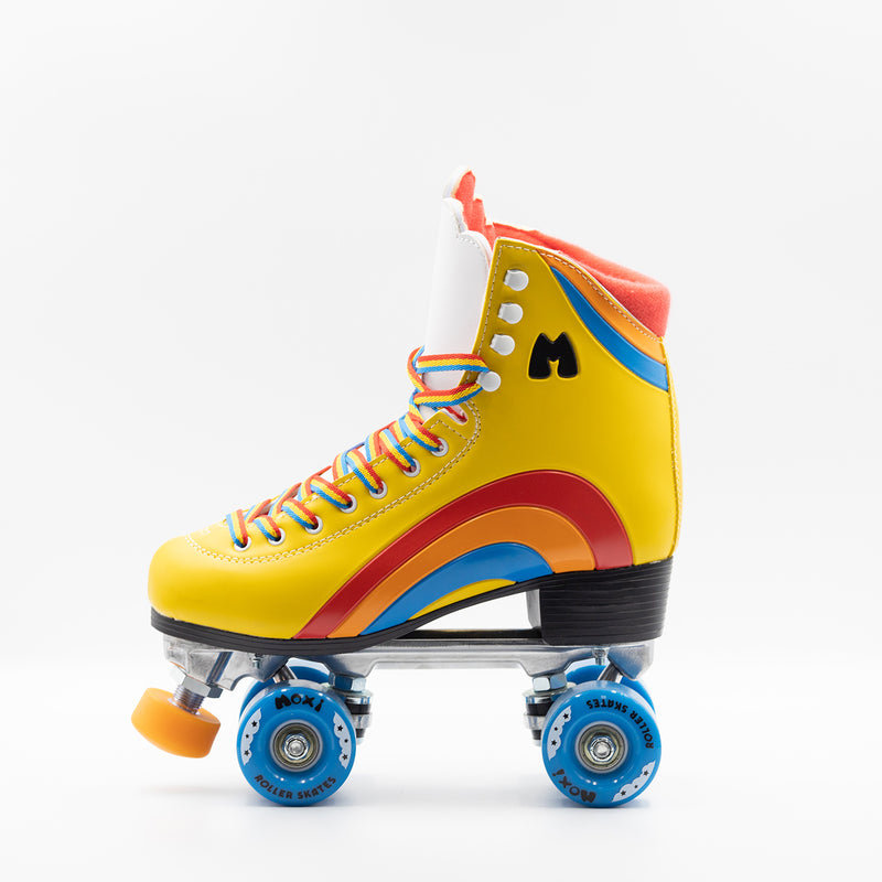 Moxi Roller Skates Rainbow Rider in Sunshine Yellow with white tongue, blue wheels and orange toe stop.
