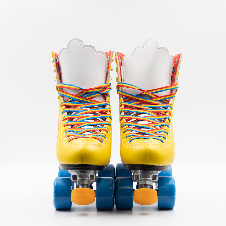 Moxi Roller Skates Rainbow Rider in Sunshine Yellow with white tongue, blue wheels and orange toe stop.