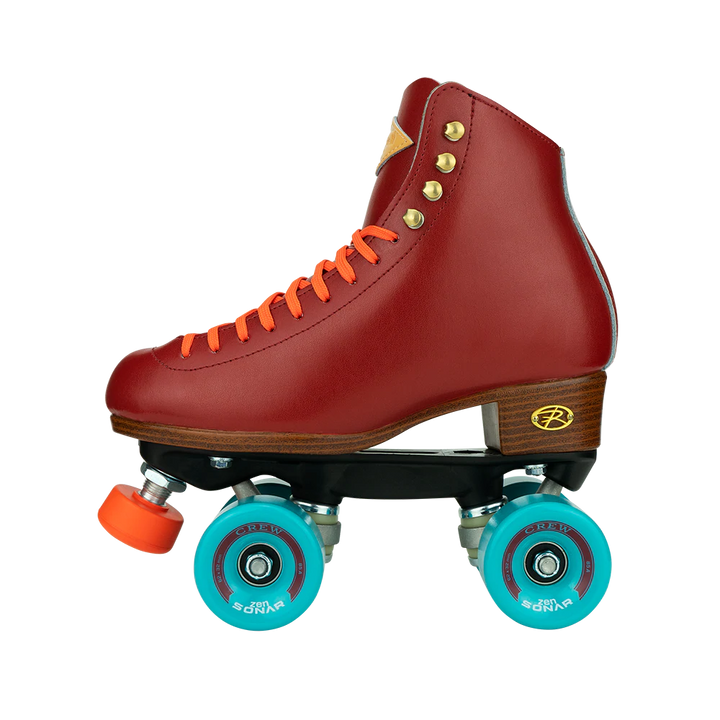 Riedell Crew roller skates in Crimson red with orange laces and toe stops, and blue wheels.