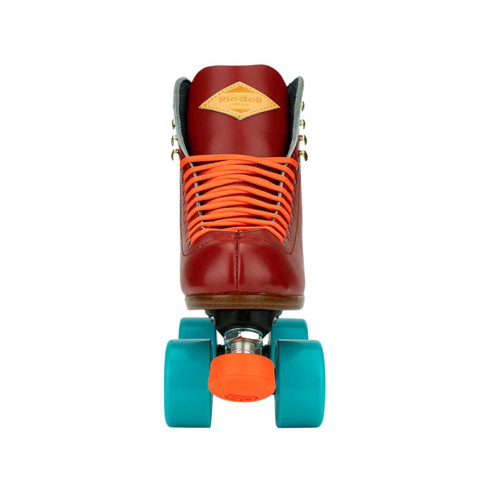 Riedell Crew roller skates in Crimson red with orange laces and toe stops, and blue wheels.