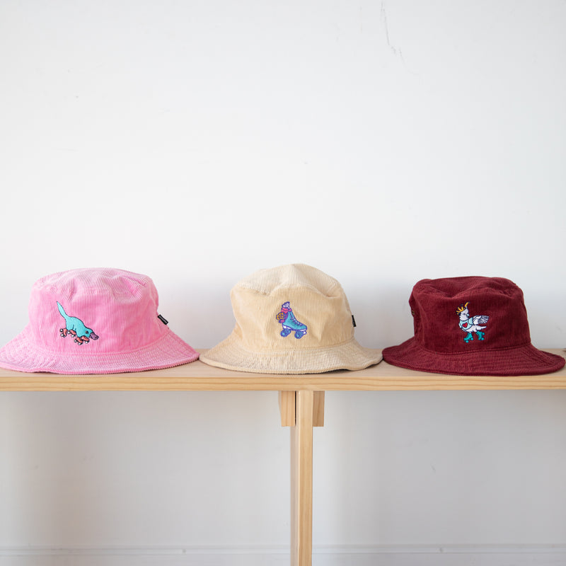 RollerFit bucket hat designs in pink, sand and berry.