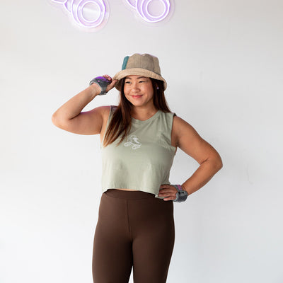 Jenn wears the RollerFit Classic Skate Tank in Pistachio green with brown leggings.