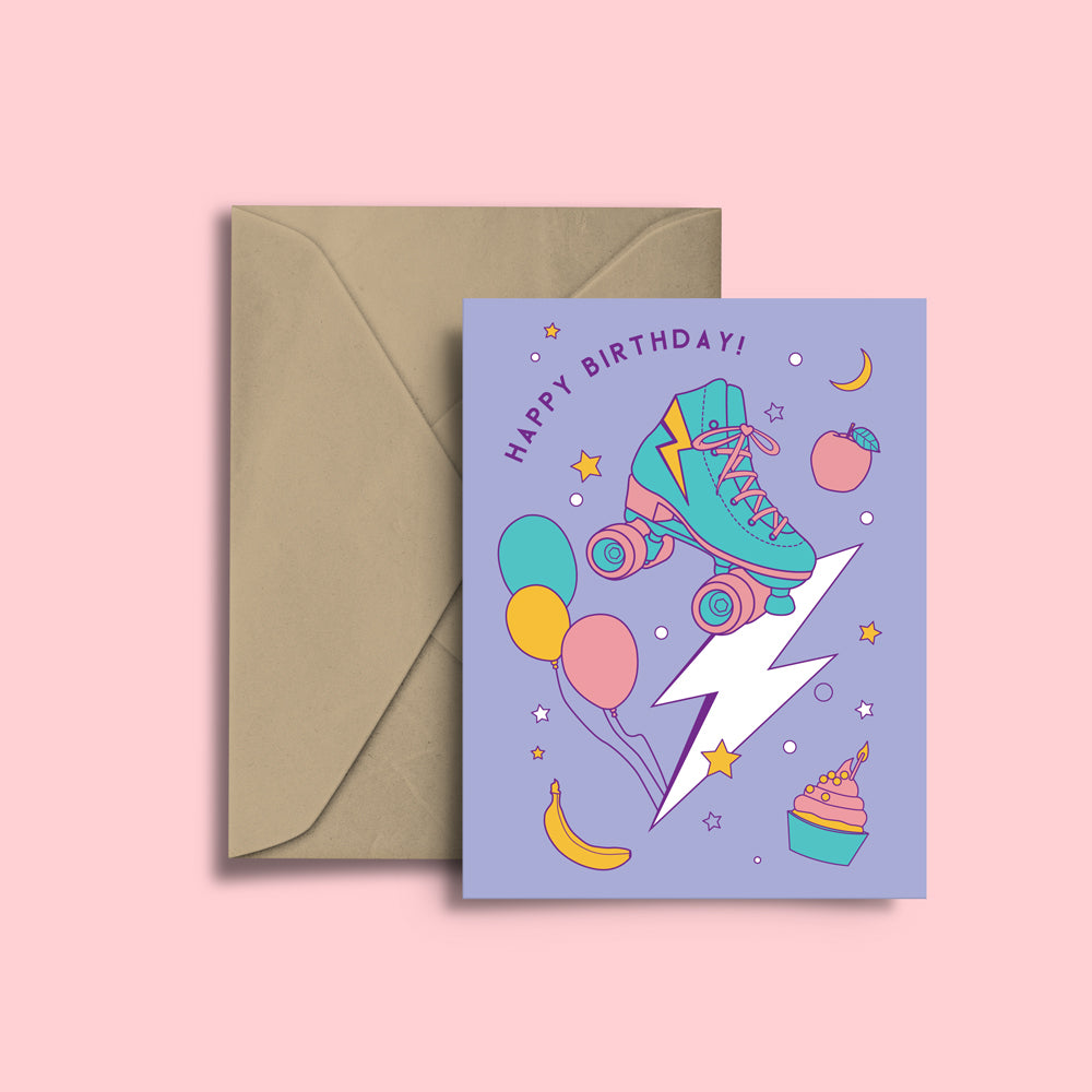 RollerFit Happy Birthday card with purple background, colourful design with balloons, roller skate, lightning bolt, cakes, bananas, apples, moons and stars.
