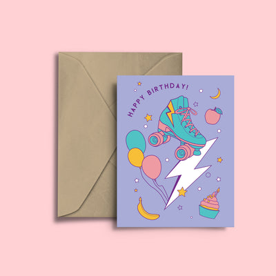 RollerFit Happy Birthday card with purple background, colourful design with balloons, roller skate, lightning bolt, cakes, bananas, apples, moons and stars.