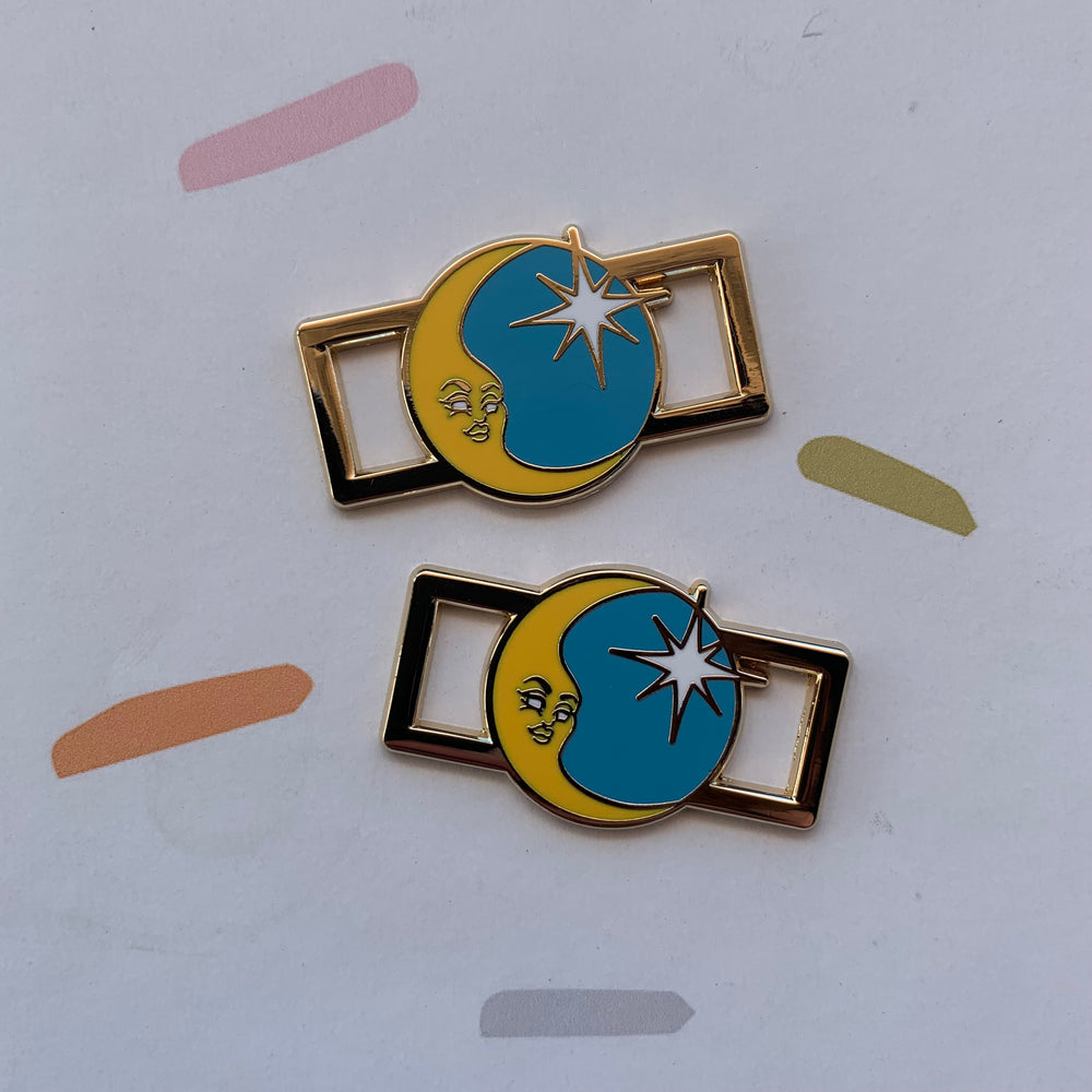 RollerFit Starry Nigh Lace Locks gold metal outer with yellow crescent moon and white star set against a light blue background.