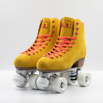 Chuffed Skates Birak roller skates with mustard yellow boots, coral laces, eyelets and logo embroidery, white wheels and toe stops.