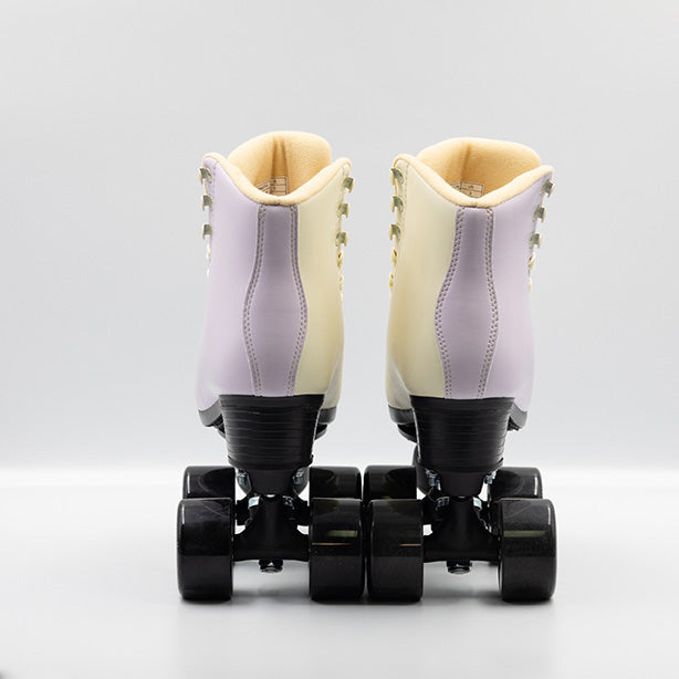 Chuffed Skates Cruiser roller skates in Sunset, a cream and lilac 2 tone boots with all black hardware.