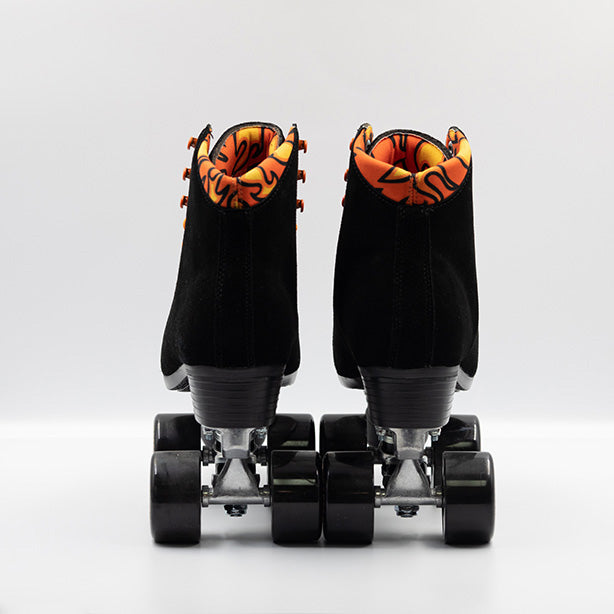 Chuffed Skates Fuegote roller skates with black suede boots, toe stops, wheels and orange laces, eyelets, logo embroidery and a piping hot flame lining.