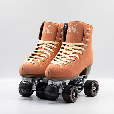 Chuffed Skates Wanderer Roller Skates in Peach Pink with cream laces and embroidered Chuffed eye logo on tongue, black wheels and toe stop.