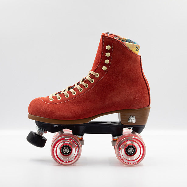 Moxi Roller Skates Lolly roller skates in Poppy red with oyster laces and eyelets, tan sole, black plate and toe stop, matching red wheels.