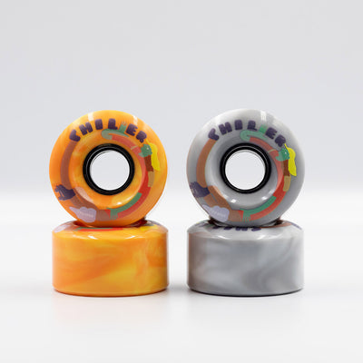 Chuffed Skates Chiller Wheels in Sunny (orange/yellow swirl) and Cloudy (grey/white swirl).