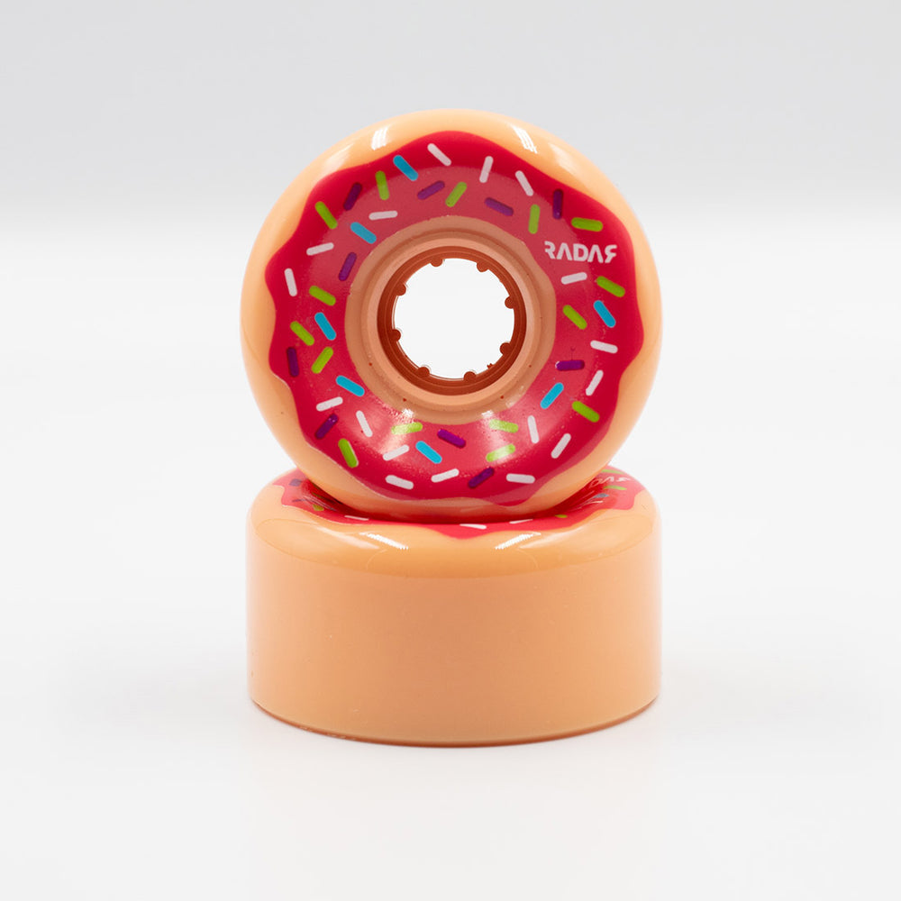 Radar Donut wheel, creamy orange with fuchsia icing look and colourful sprinkles. 
