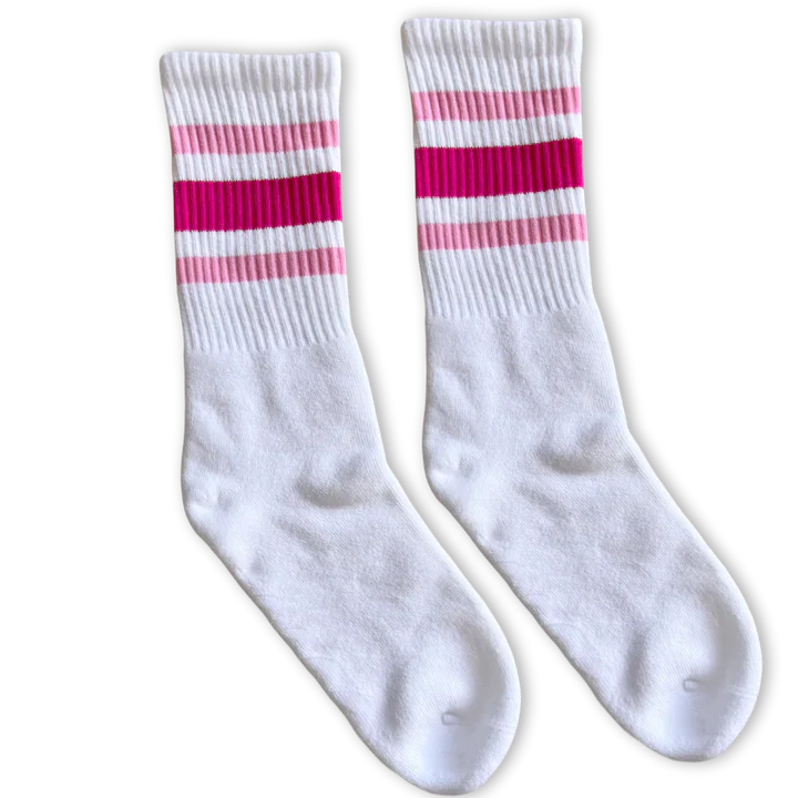 Socco white tube socks with 3 pale pink and fuchsia stripes above the ankle.