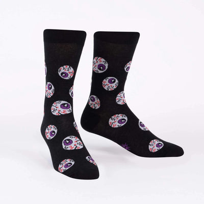 All eyes on me sock design black socks with white bloodshot eyeballs with purple pupils.