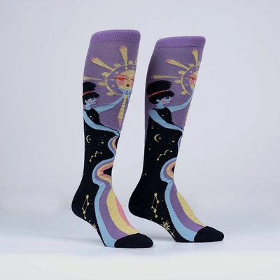 Black and purple socks with female bodies holding up a sun.