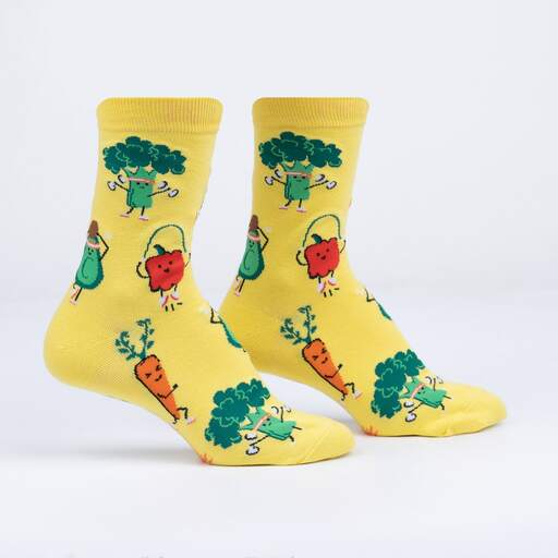 Pastel yellow crew socks with cartoon broccoli, capsicum, carrot and avocado exercising.