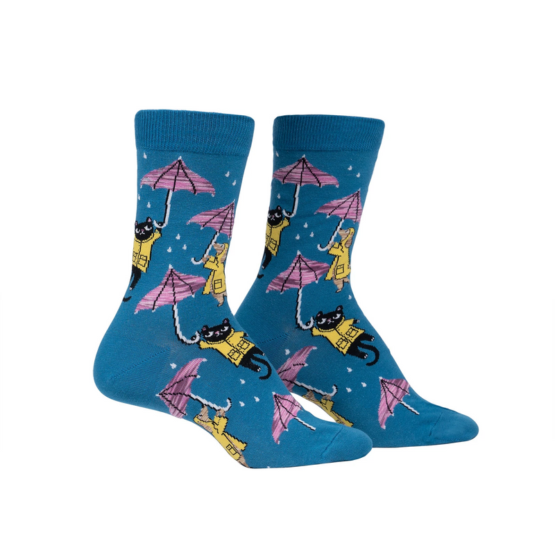Navy blue socks with cartoon cats and dogs in raincoats with umbrellas as rain drops down.