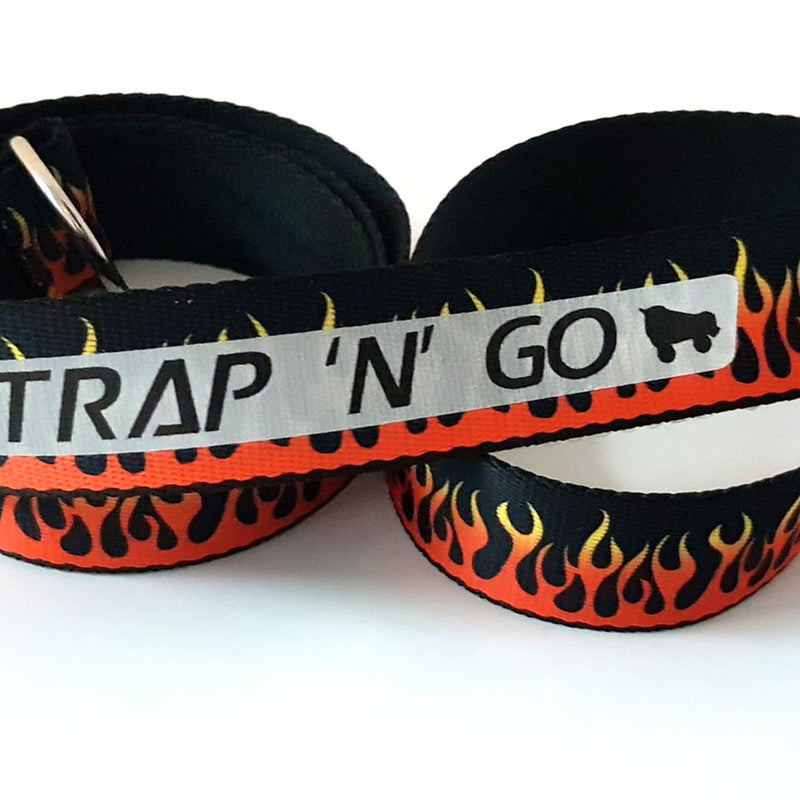 Strap N Go skate leash in black with orange and yellow flame trail print.