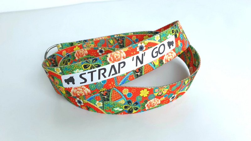 Strap N Go skate leash in red, green, yellow, pink, blue and black collage floral print.