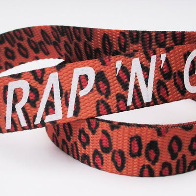 Strap N Go skate leash in orange and red jaguar print.